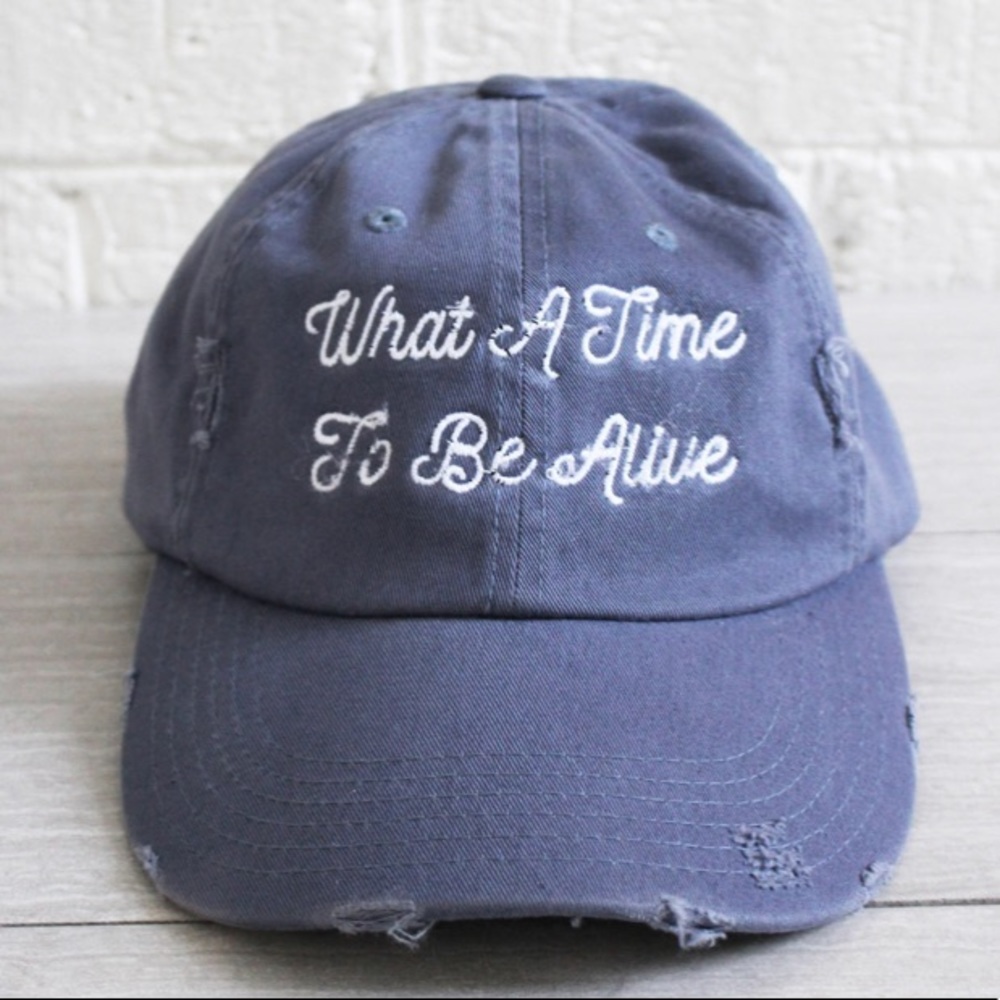 “What a time to be alive” distressed baseball hat